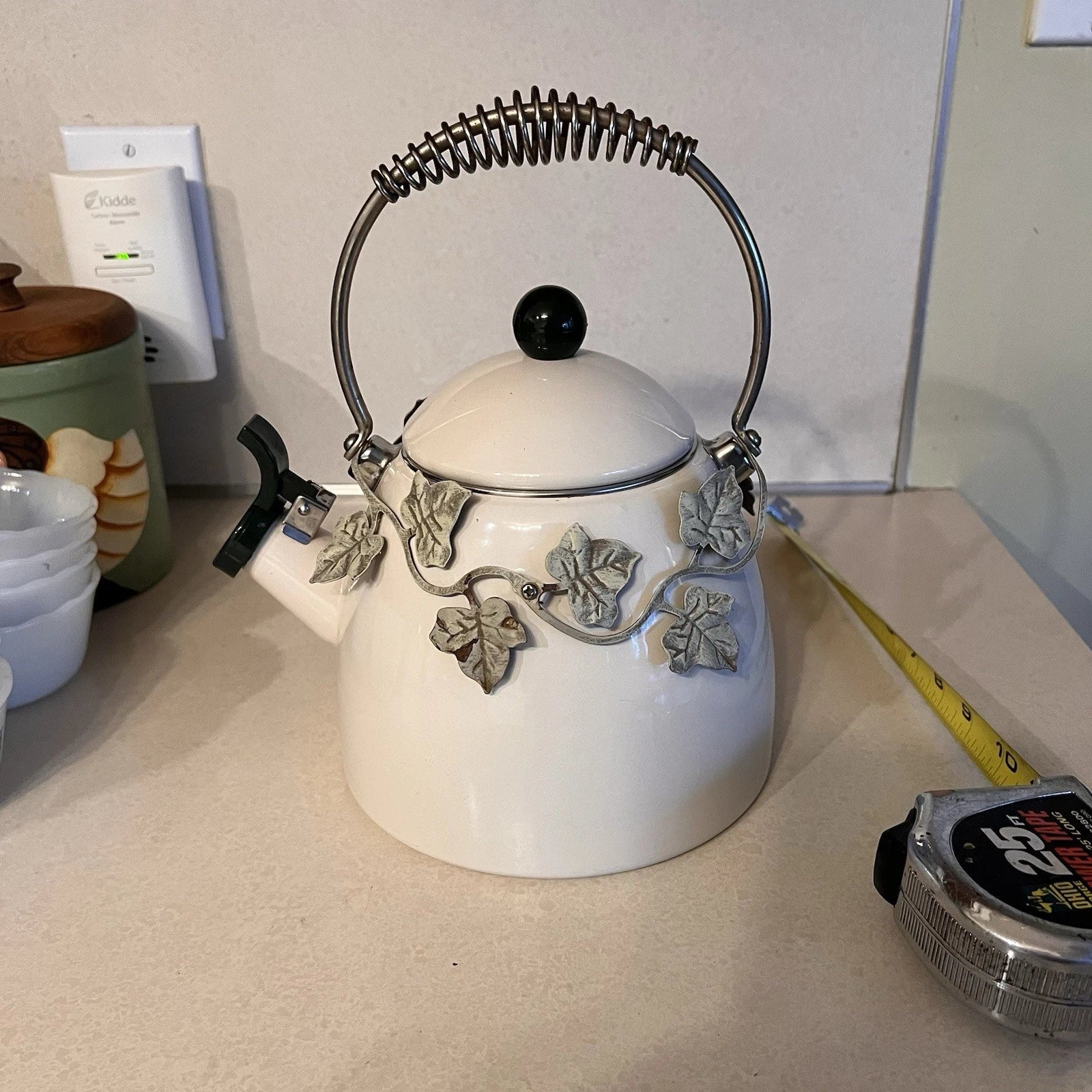 Enamel Whistling Tea Kettle Via Ancona White Ivory, Green Knob Ivy Garland