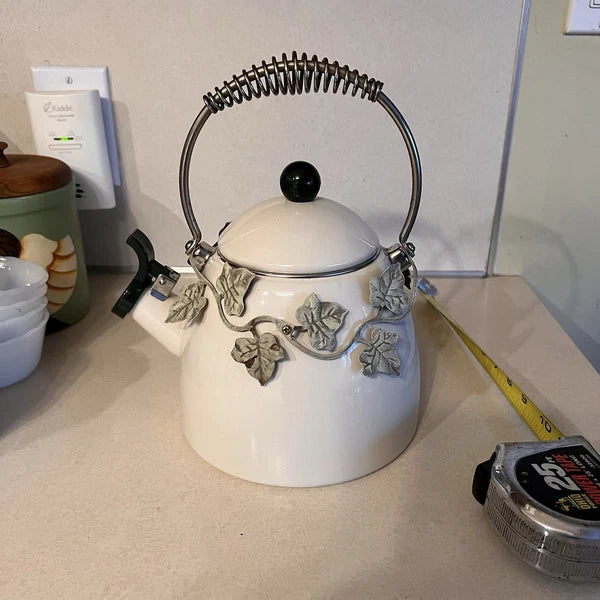 Enamel Whistling Tea Kettle Via Ancona White Ivory, Green Knob Ivy Garland