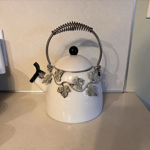 Enamel Whistling Tea Kettle Via Ancona White Ivory, Green Knob Ivy Garland